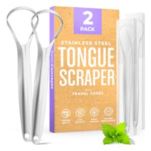 Stainless steel tongue scraper kit with carrying case and instructional guide displayed.