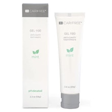 Two white toothpaste tubes with green leaf logos and gray caps displayed side by side.