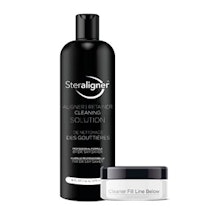 Black shampoo bottle and white jar skincare product displayed against white background.