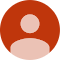 Default user profile avatar icon in orange and tan colors for dental practice website.