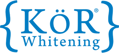 KÖR Whitening logo in blue with decorative braces symbols on either side.